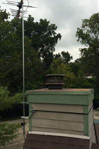 TV antenna mounted on wood chimney
